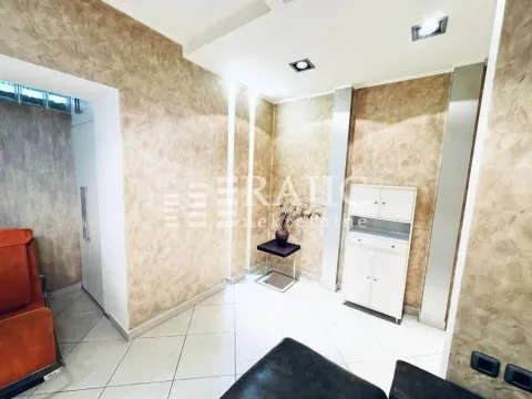 Living room with decorative walls and light floor tiles. - image 4