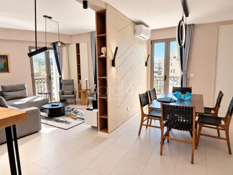 Spacious living room with a dining area and modern furniture. - image 7