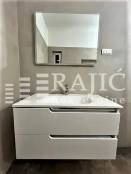 Modernly equipped bathroom with a washbasin and mirror. - image 13