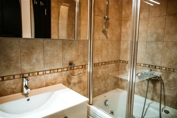 Bathroom with a shower and sink.