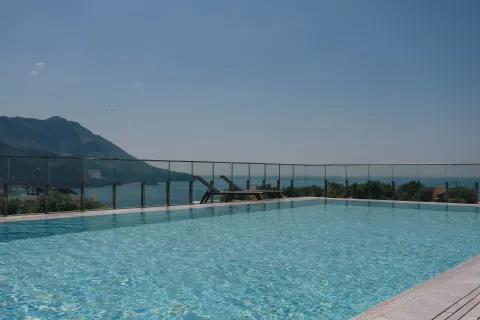 Outdoor swimming pool with sea and mountain views. - image 16