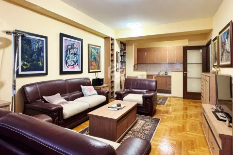 Furnished living room with sofa set and view of the kitchen in the background. - image 4