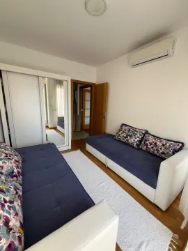 Living room with a sofa set and a wardrobe. - image 8
