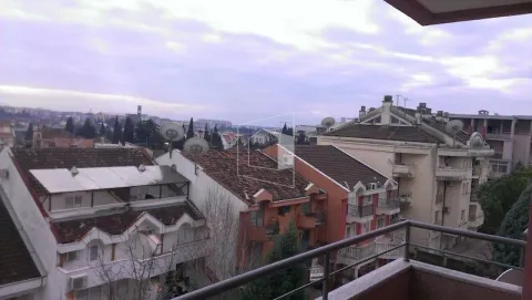 View from the terrace overlooking surrounding buildings and the neighborhood. - image 11