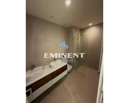 Modernly equipped bathroom with a double washbasin and a walk-in shower. - image 8