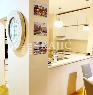 Modern kitchen connected to the dining area. - image 2