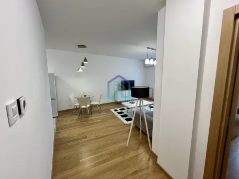 Living room with a dining area and parquet flooring. - image 6