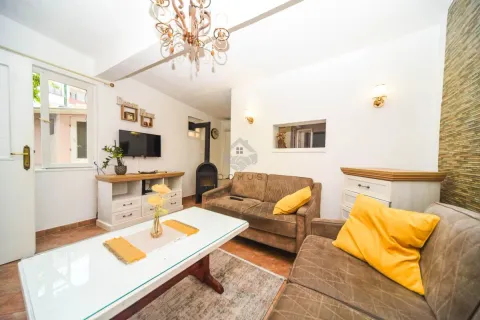 Living room with sofa set, coffee table, and fireplace. - image 2