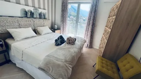 Furnished bedroom with a double bed, wardrobe, and access to the terrace. - image 6