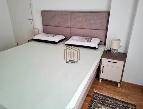 Furnished bedroom with a double bed and nightstands. - image 4