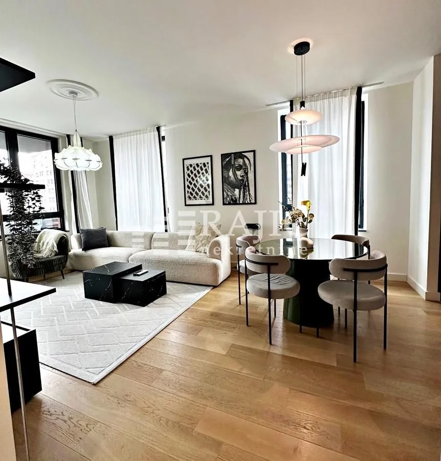 Spacious and bright living room with a dining area and modern furniture.