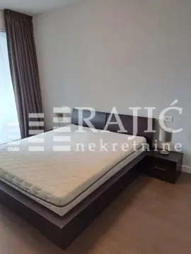 Bedroom with a double bed and a nightstand. - image 10