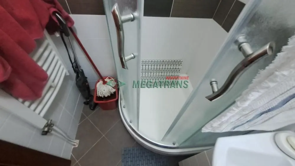 A corner of the bathroom with a shower cabin.