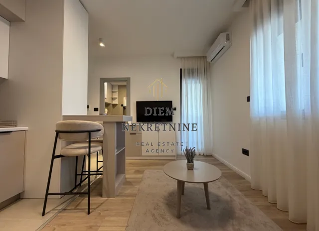 Modern living room with a bar and dining area.
