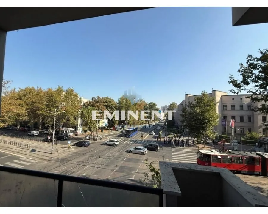 View from the balcony overlooking the street and urban surroundings.