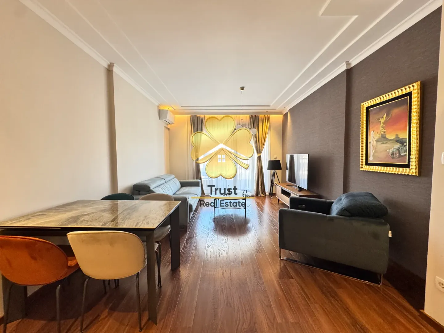 Living room with a dining area and sofa.