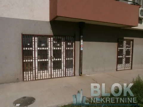 View of the commercial space entrance with security grills. - image 8