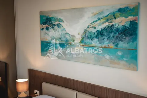Part of the bedroom with a headboard and an art painting on the wall. - image 15