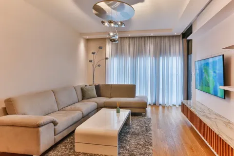 Bright living room with a modern sectional sofa. - image 9
