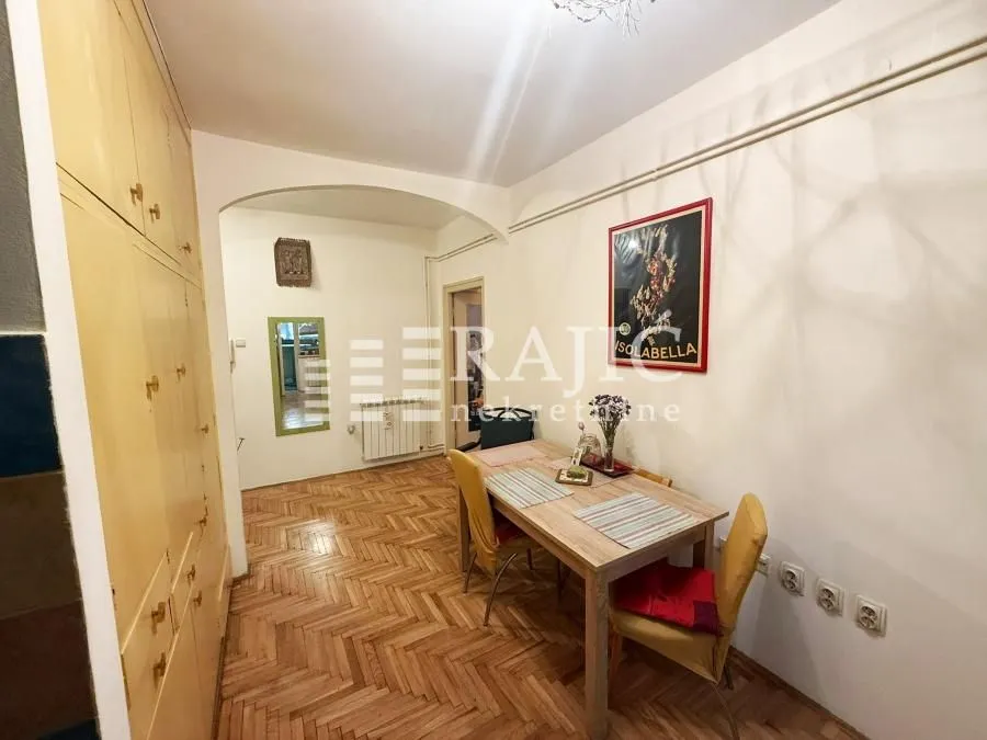 Dining area with a wooden table and chairs.