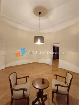 Living room with parquet flooring and seating set. - image 13
