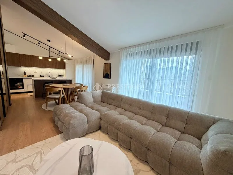 Spacious living room connected to the dining area and kitchen.