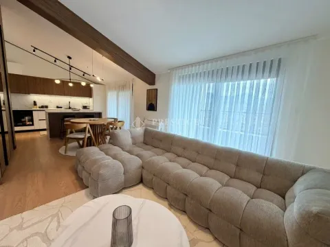 Spacious living room connected to the dining area and kitchen. - image 5