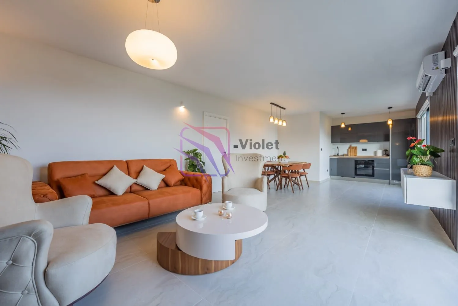 Spacious living room connected with the kitchen and dining area.