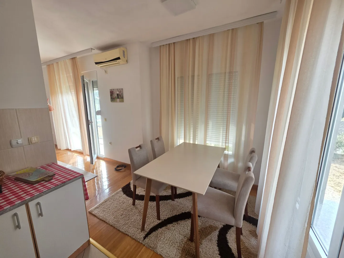 Living room with dining area and seating set.