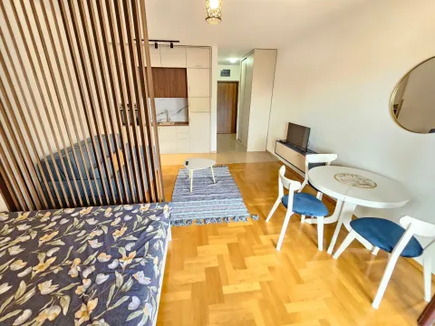 Living room with dining area and kitchen in the background. - image 10