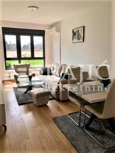 Living room with dining area and sofa set.