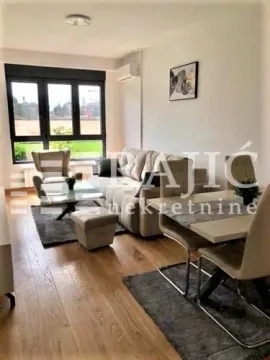 Living room with dining area and sofa set. - image 2