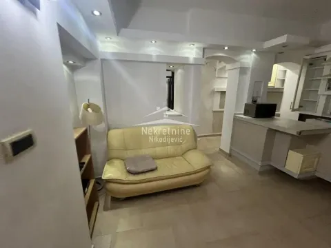 Living room with sofa and view towards the kitchen. - image 3