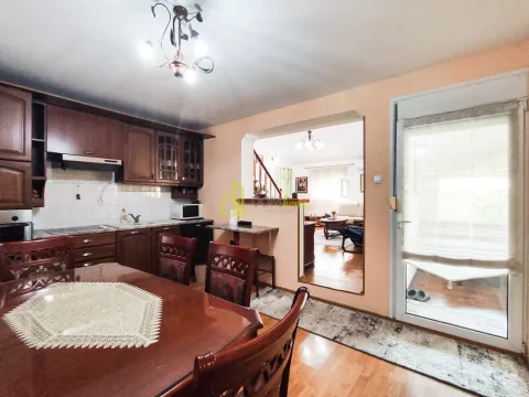 Dining area with kitchen and a view of the living room. - image 12