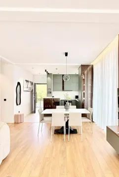 Modern kitchen with dining area and open-plan layout. - image 12