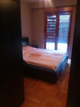 Simple bedroom with a double bed. - image 5