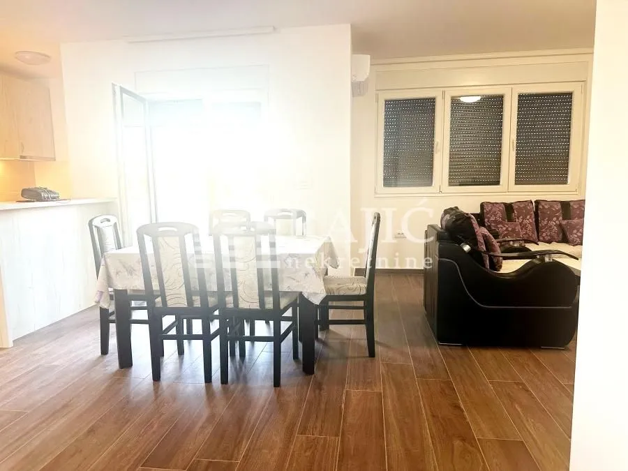 Living room with a dining area and seating set.
