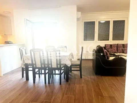 Living room with a dining area and seating set. - image 4
