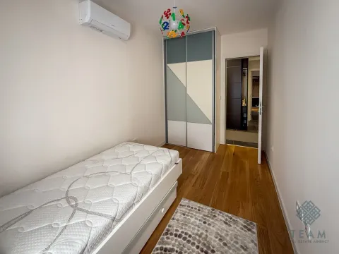 Children's bedroom with a bed, wardrobe, and air conditioning unit. - image 7