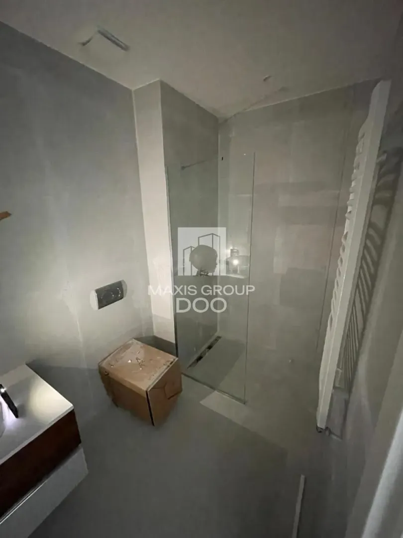 Newly equipped bathroom with a walk-in shower and vanity.