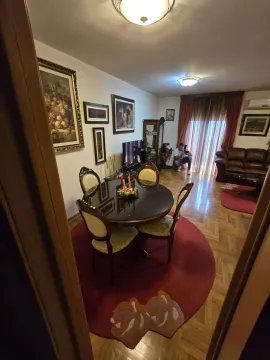 Dining area with a round table and chairs connected to the living room. - image 9
