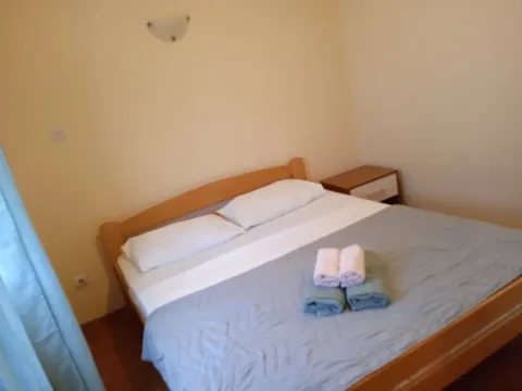 Furnished bedroom with a double bed. - image 11