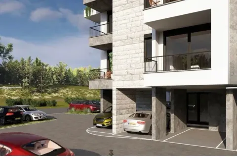 Spoljašnji izgled moderne stambene zgrade sa parking prostorom u dvorištu. - image 2