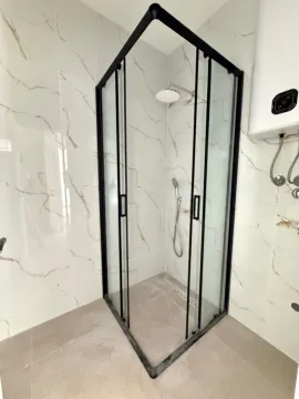 Modern bathroom with a shower cabin. - image 8