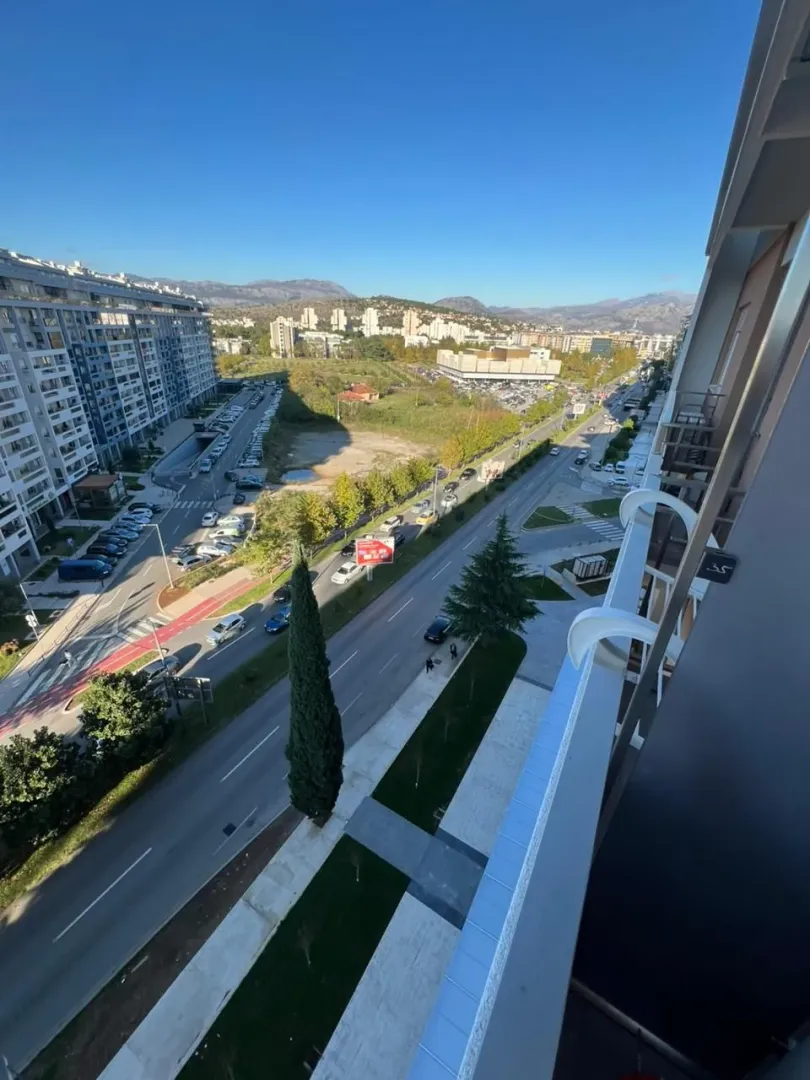 View from the terrace of the city street and surrounding buildings.