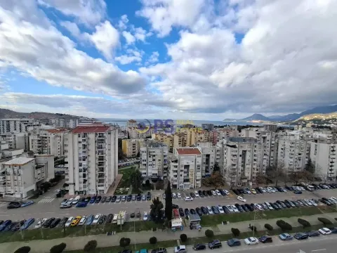 View from the terrace overlooking the city neighborhood and the sea in the distance. - image 15