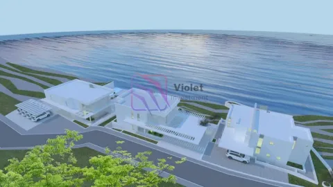 Pogled iz vazduha na kompleks modernih vila uz obalu mora. - image 13