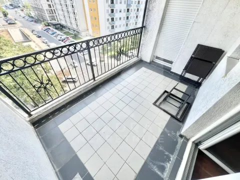 Unfurnished balcony with tiled flooring and street view. - image 7