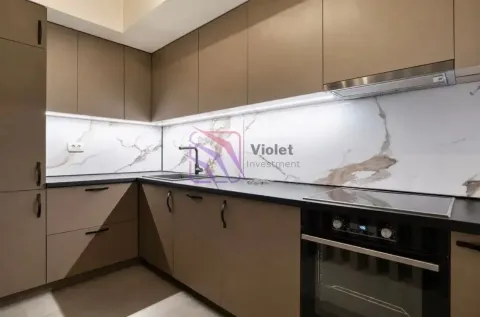 Modern kitchen with built-in cabinetry and under-cabinet lighting. - image 6