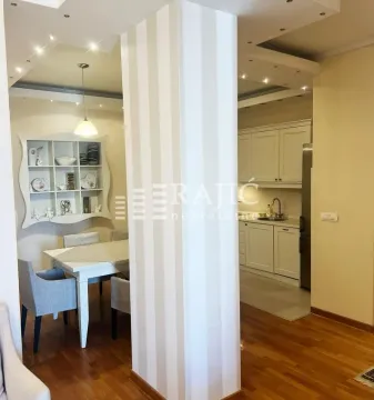 Living room with dining area and view of the kitchen. - image 6